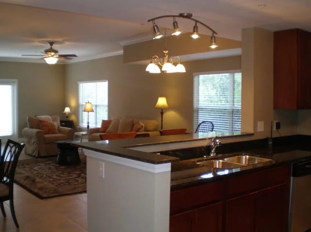Living room and kitchen with bar area Image at Upper Westside Apartments in Gainesville Student Accommodation