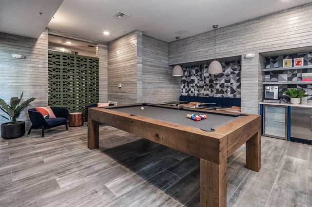 Pool table lounge with chairs and coffee station lounge area at The Aves @ Twelve 100 in Orlando Student Accommodation