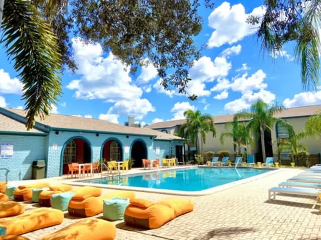 Pool area with beanbags and lounge chairs exterior at College Town @ USF in Tampa Student Accommodation
