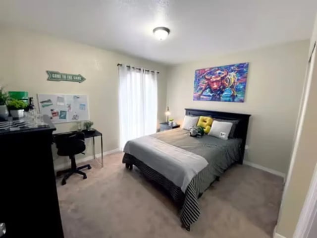 Bed desk whiteboard and artwork bedroom at College Town @ USF in Tampa Student Accommodation