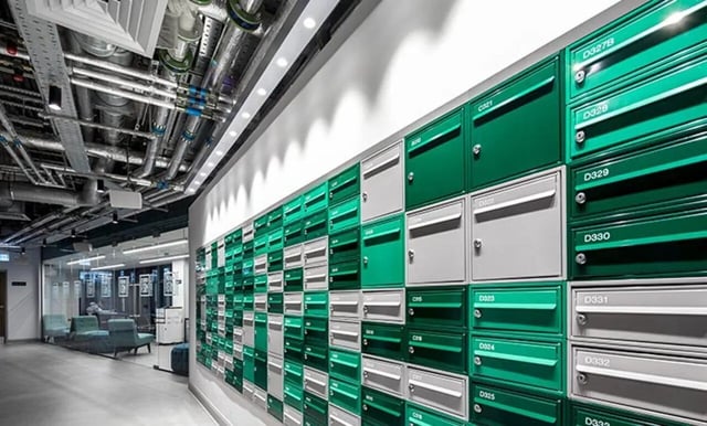Mailboxes with green and grey doors lobby area at Collegiate Eclipse in Cardiff Student Accommodation
