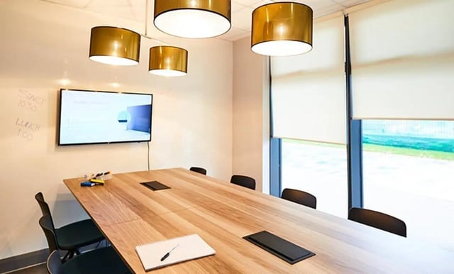 Table chairs screen whiteboard study area at Collegiate Eclipse in Cardiff Student Accommodation
