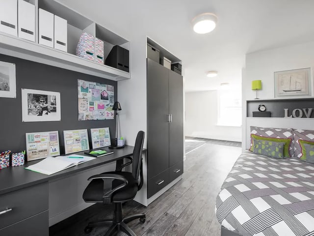 Desk chair wardrobe bed with patterned duvet bedroom at Yugo Crescent Place in Southampton Student Accommodation