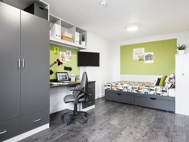 Wardrobe desk chair bed television bedroom at Yugo Crescent Place in Southampton Student Accommodation