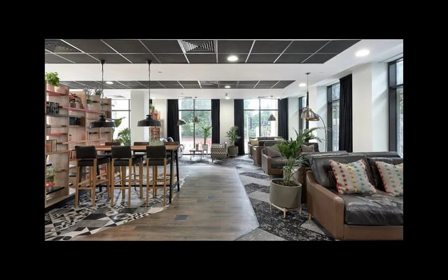Bar with stools and lounge seating living room at Southampton Crossings in Southampton Student Accommodation
