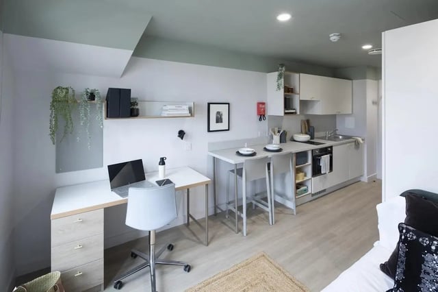 Desk chair laptop kitchen counters dining bar area studio at The Keel Houses in Edinburgh Student Accommodation