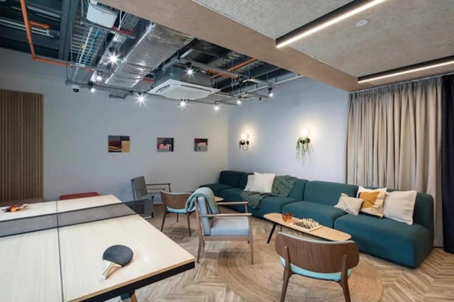 Ping pong table couch chess set living area at The Keel Houses in Edinburgh Student Accommodation