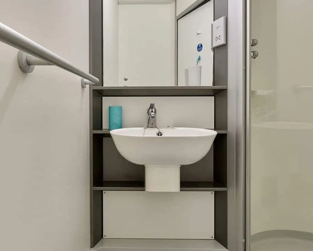 Sink with faucet and toiletries bathroom at Exeter Trust House in Exeter Student Accommodation