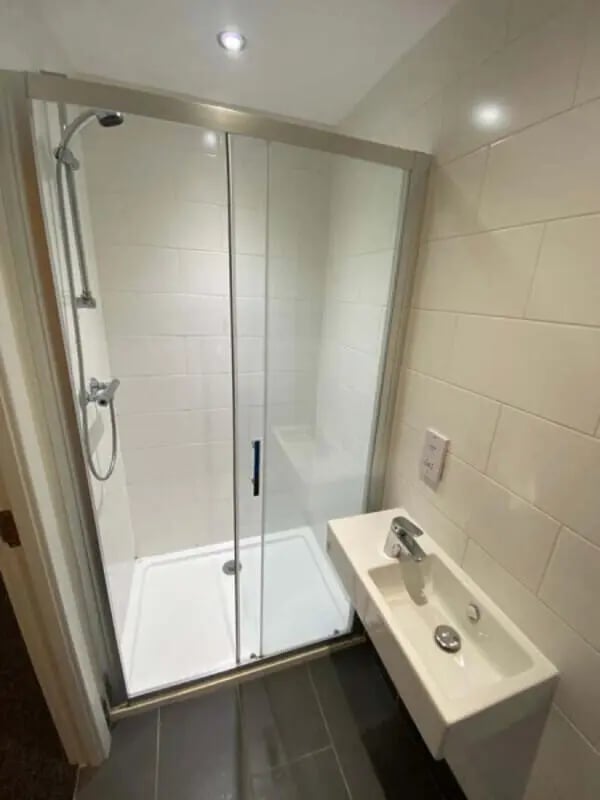 Shower cubicle sink and tiled walls bathroom at St Mary's House Sheffield in Sheffield Student Accommodation