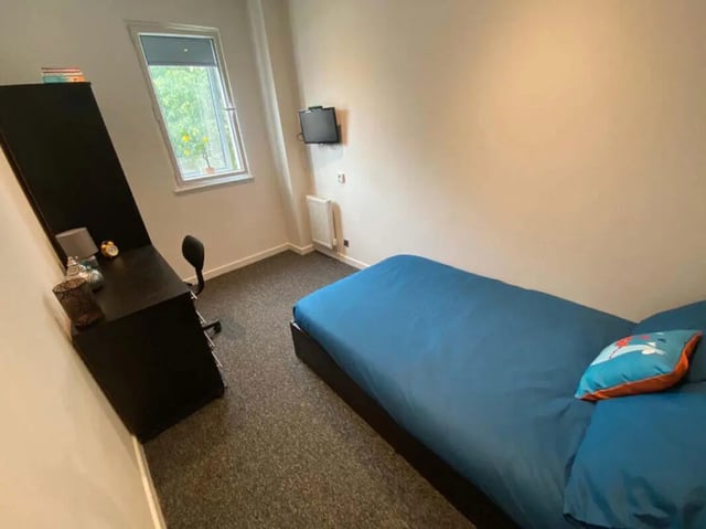 Bed desk chair television radiator bedroom at St Mary's House Sheffield in Sheffield Student Accommodation