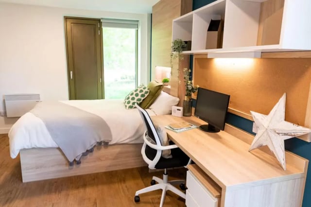 Bed desk chair shelving unit bedroom study area at Bankside Student Living - Guildford in Guildford Student Accommodation