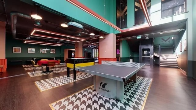 Ping pong table foosball table lounge area Game room at Guilden Village in Guildford Student Accommodation