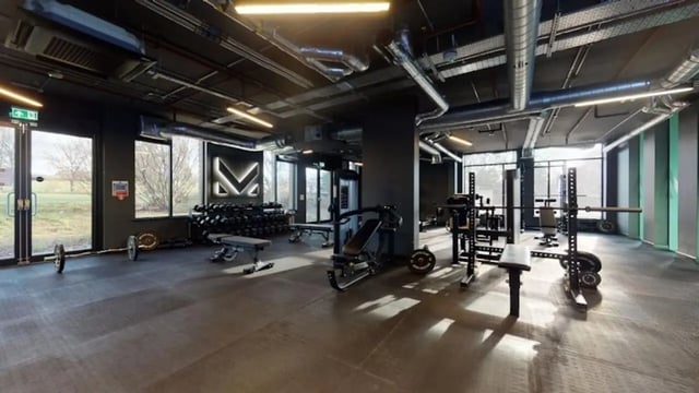 Weight racks benches dumbbells and barbells gym at Guilden Village in Guildford Student Accommodation