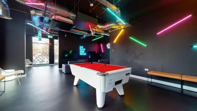 Pool table neon lights modern lounge at Guilden Village in Guildford Student Accommodation