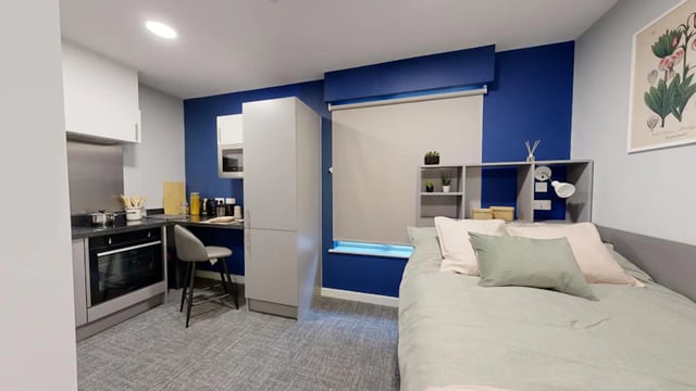 Kitchen bed with shelves and art Bedroom at Ash Grove Court - Guildford in Guildford Student Accommodation