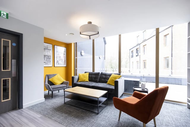 Sofa chairs coffee table living room at Ash Grove Court - Guildford in Guildford Student Accommodation