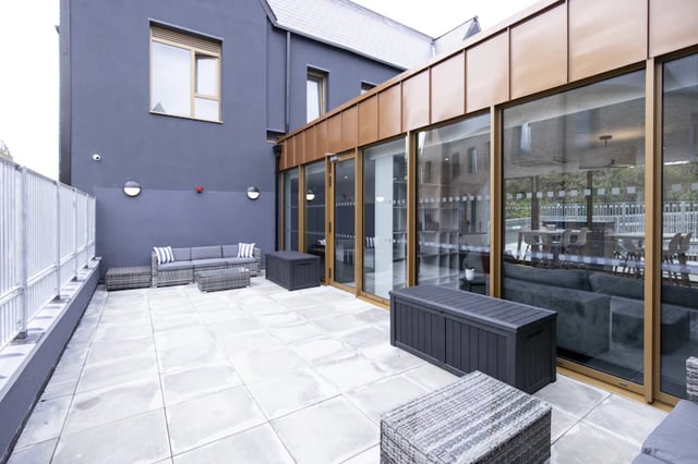 Patio furniture with sofas and tables exterior at Ash Grove Court - Guildford in Guildford Student Accommodation