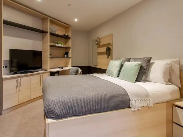 Bed TV desk shelving modern student bedroom at Hythe Mills in Colchester Student Accommodation