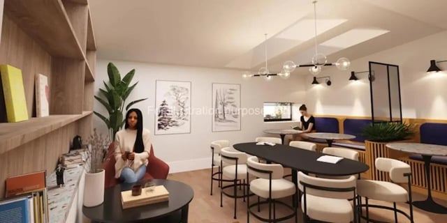 Seating and tables in communal area living room at Waterloo House in York Student Accommodation