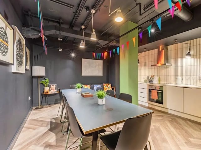 Dining table chairs sofa kitchen common area at Crown House Brighton in Brighton Student Accommodation