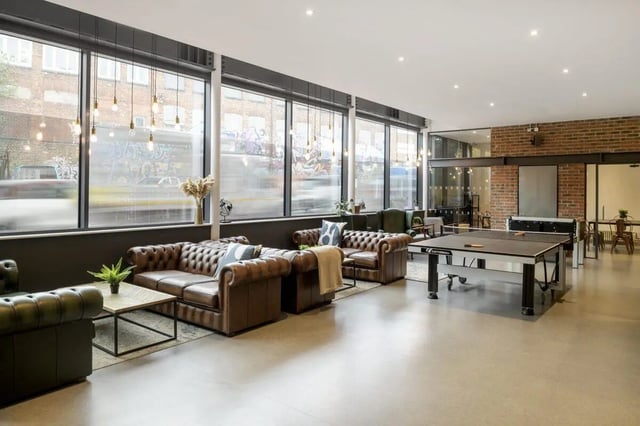 Leather sofas ping pong table large windows common room at Stepney Yard in Newcastle Upon Tyne Student Accommodation