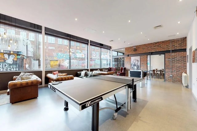 Ping pong table leather sofas and lounge area living room at Stepney Yard in Newcastle Upon Tyne Student Accommodation