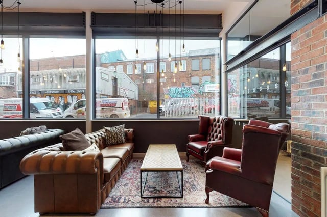Leather sofas armchairs coffee table living room at Stepney Yard in Newcastle Upon Tyne Student Accommodation