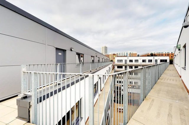 Balcony walkway with metal railings exterior at Stepney Yard in Newcastle Upon Tyne Student Accommodation