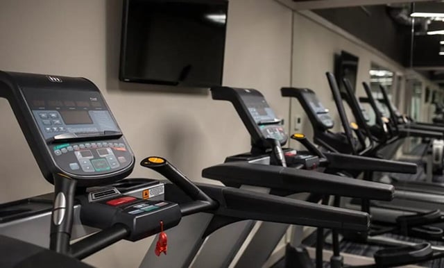 Treadmills and television gym equipment gym at Collegiate Roman House in Derby Student Accommodation
