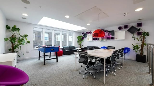 Foosball table sofa study table chairs living room at Collegiate Middle Street in Portsmouth Student Accommodation