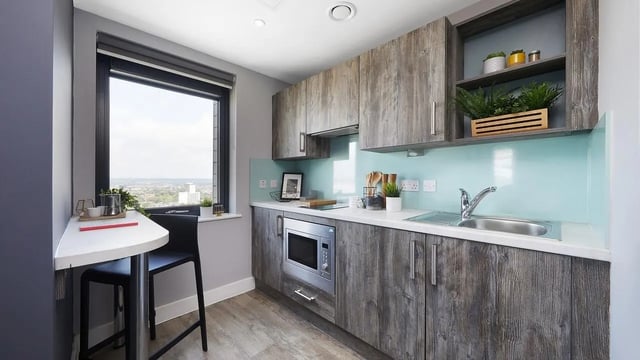 Modern kitchen with breakfast bar and window kitchen at Collegiate Crown Place Portsmouth in Portsmouth Student Accommodation