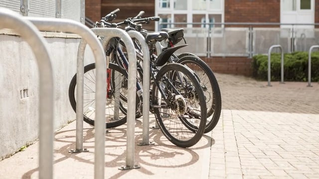 Bicycles parked at bike rack exterior at Collegiate Upper Quay House in Gloucester Student Accommodation