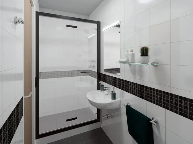 Shower sink mirror towel rack bathroom at Depot Point in London Student Accommodation