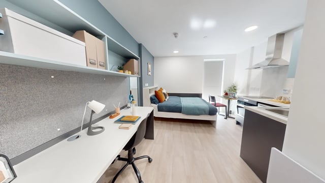 Desk bed kitchen area and cabinets studio apartment at Enso in Colchester Student Accommodation