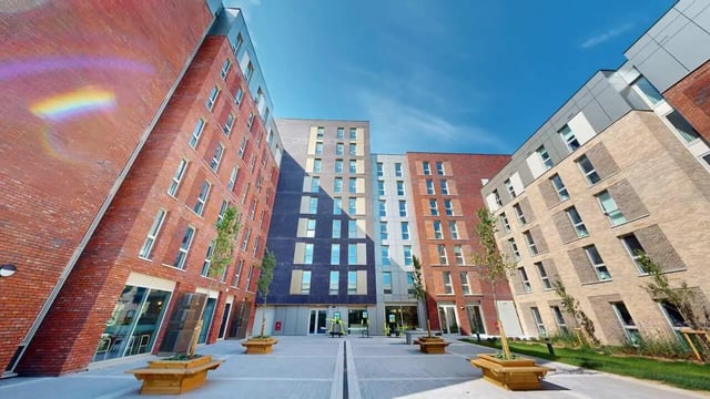 Modern student accommodation buildings with outdoor seating exterior at Enso in Colchester Student Accommodation