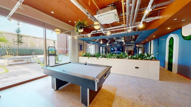 Pool table and gym equipment common area at Enso in Colchester Student Accommodation