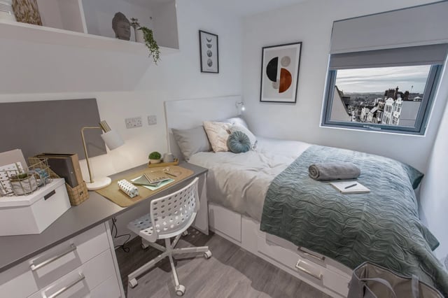 Desk bed chair and artwork bedroom at The City Arcade - Exeter in Exeter Student Accommodation