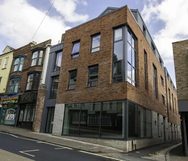 Brick building with large windows exterior at The City Arcade - Exeter in Exeter Student Accommodation