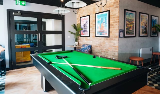 Pool table cues and triangle common area at Boutique Student Living - Exeter in Exeter Student Accommodation
