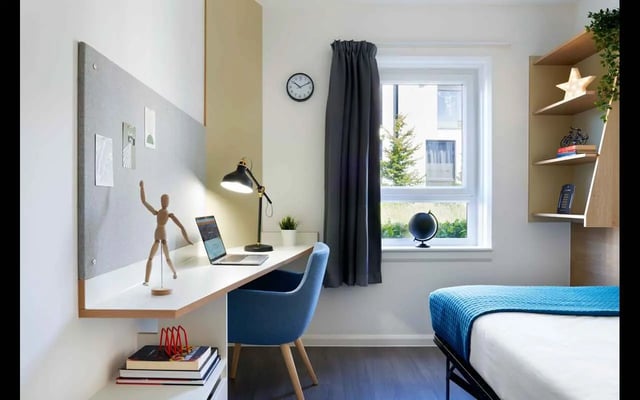 Desk lamp laptop mannequin books bed bedroom at Hampton Square in Southampton Student Accommodation