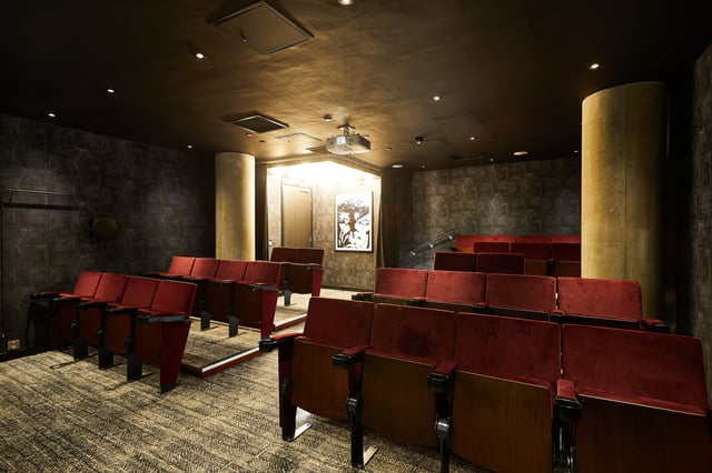 Red velvet cinema seats and projector playing area at Vita Student St.Albans in Leeds Student Accommodation