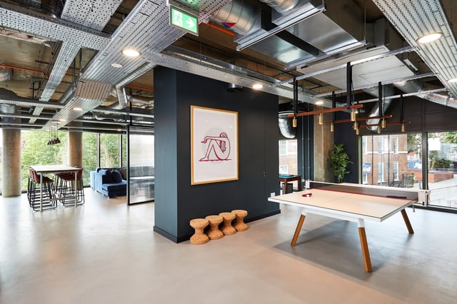Ping pong table with seating and artwork common area at Vita Student St.Albans in Leeds Student Accommodation