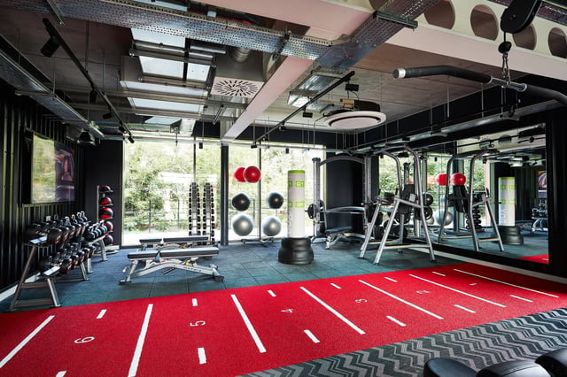 Dumbbells benches punching bag exercise machines gym at Vita Student Pebble Mill in Birmingham Student Accommodation