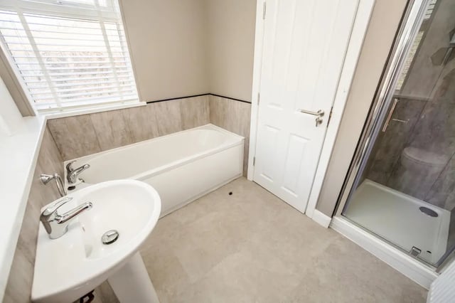 Sink bathtub shower and door bathroom at Humber Portfolio in Hull Student Accommodation