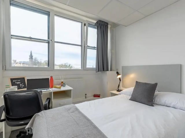 Desk laptop water bottle bed bedroom study area at Glasgow West-End in Glasgow Student Accommodation