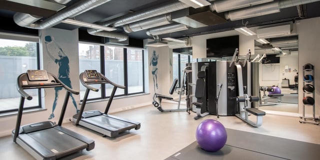 Two treadmills weight machines exercise ball gym at Canvas Capital House in Southampton Student Accommodation