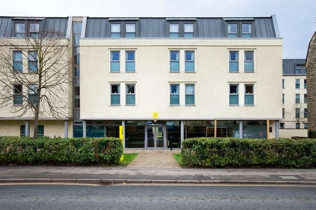 Cream building many windows manicured hedges exterior at Charlton Court in Bath Student Accommodation
