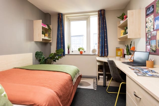 Bed desk chair laptop plants Bedroom at Joseph Stones House in Leeds Student Accommodation