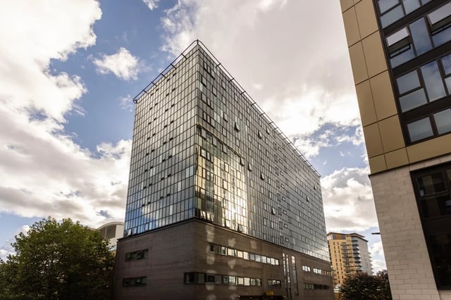 Glass and brick building with windows exterior at Joseph Stones House in Leeds Student Accommodation