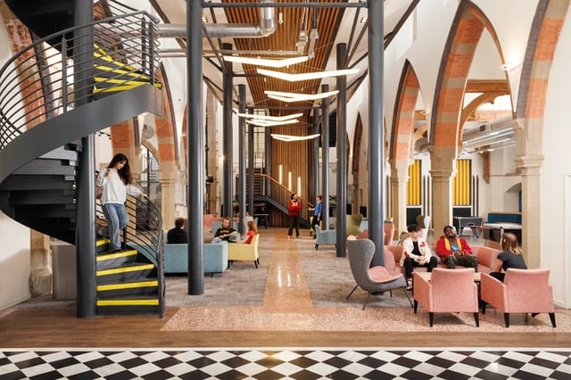 Spiral staircase and lounge area with students communal area at St Vincents Place in Sheffield Student Accommodation